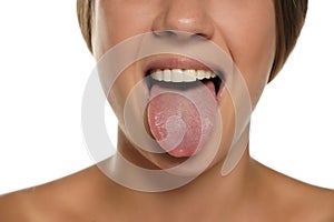 Young woman sticking out her tongue
