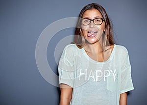 Young woman sticking out her tongue at the camera