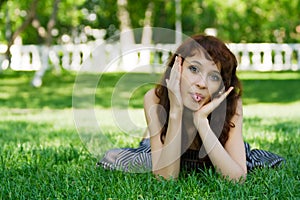 Young woman sticking out tongue.