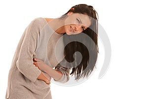 Young woman with stomach ache suffering isolated over white back