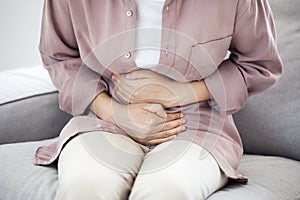 Young woman with stomach pain photo