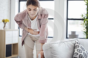 Young woman with stomach pain