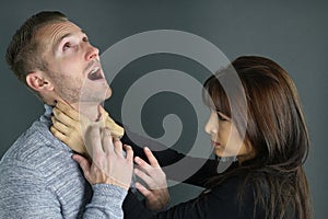 Young woman strangling her boyfriend photo