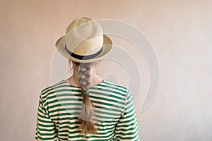 Young woman in a straw hat