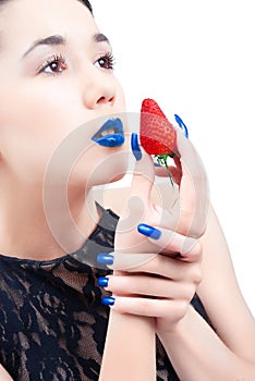 Young woman with strawberry and blue nails