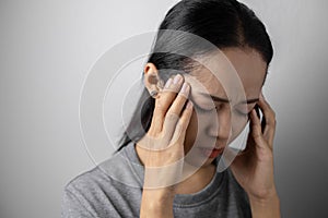 Young woman with of stress and headaches