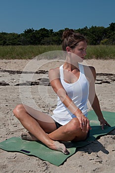 Young Woman Stretching on Beach