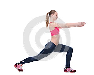 Young woman stretching leg muscles