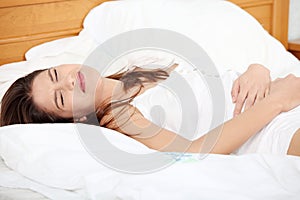 Young woman stroking her belly