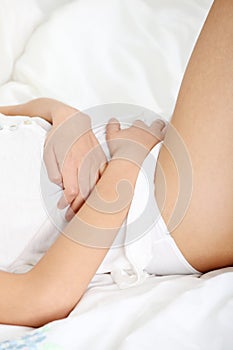 Young woman stroking her belly