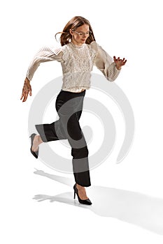 Young woman, student, business lady running isolated over white background. Concept of business, office lifestyle