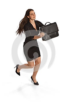 Young woman, student, business lady running isolated over white background. Concept of business, office lifestyle