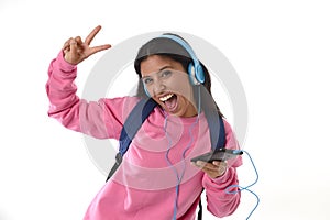 Young woman or student girl with mobile phone listening to music headphones singing and dancing