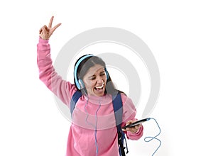 Young woman or student girl with mobile phone listening to music headphones singing and dancing