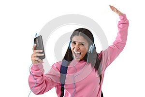 Young woman or student girl with mobile phone listening to music headphones singing and dancing