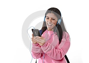 Young woman or student girl with mobile phone listening to music headphones singing and dancing