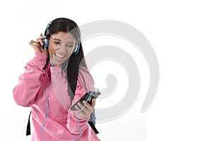 Young woman or student girl with mobile phone listening to music headphones singing and dancing