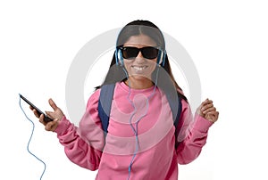 Young woman or student girl with mobile phone listening to music headphones singing and dancing