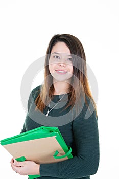 Young woman student holding folder in green sweater on white background