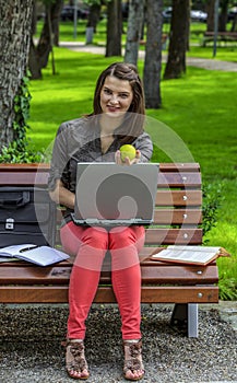 Young Woman Studying in a Park