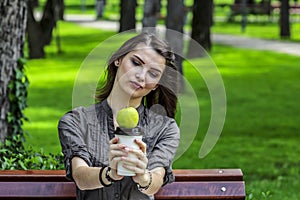 Young Woman Studying in a Park