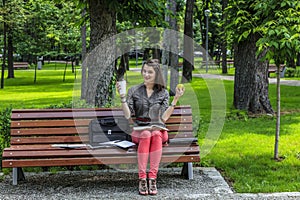 Young Woman Studying in a Park