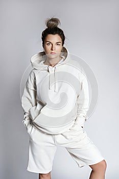 Young woman stylish woman wearing white hoodie