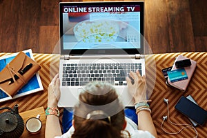 Young woman subscribing to internet tv photo