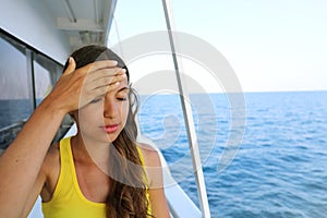 Young woman suffer from seasickness during vacation on boat.