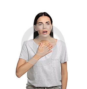 Young woman suffering from breathing problem on white background