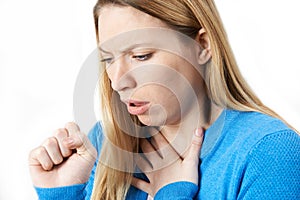 Young Woman Suffering With Cough