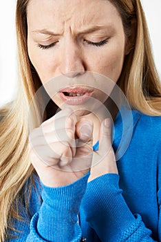 Young Woman Suffering With Cough photo