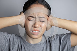 Young woman is suffering of earache