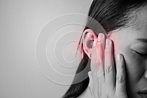 Young woman is suffering of earache