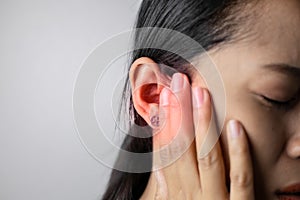 Young woman is suffering of earache