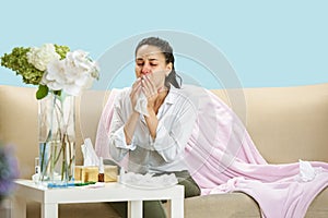 Young woman suffering from hausehold dust or seasonal allergy.