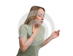 Young woman suffering from pain during breathing on white background