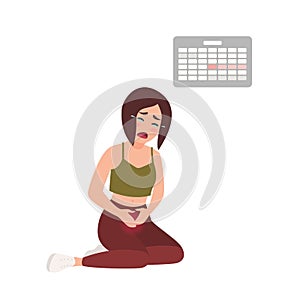 Young woman suffering from painful menstruation against calendar hanging on wall on background. Distressed girl sitting