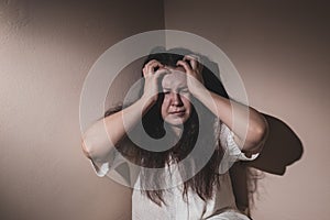 Young woman suffering from a severe depression and anxiety, psychiatric problem after covid-19