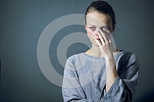 Young woman suffering from severe depression/anxiety/sadness