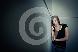 Young woman suffering from a severe depression photo