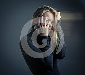 Young woman suffering from a severe stomach pain/depression