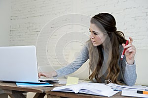 Young woman suffering stress doing domestic accounting paperwork bills