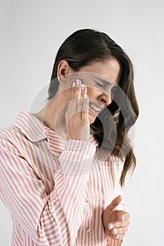 Young woman suffering from toothache