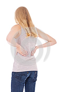 Young woman suffers from back pain