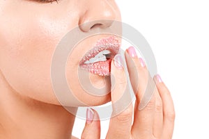 Young woman with sugar lips on white background