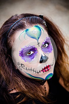 Young woman with sugar skull makeup