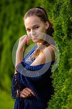 A young woman in a summer park