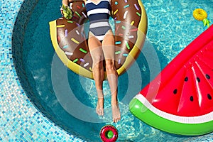 Young woman on summer pool party