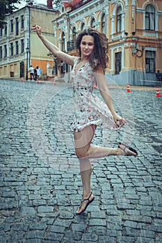 Young woman in the summer rain